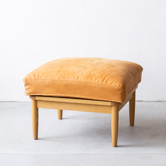 Flow Ottoman in oiled leather